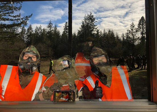 Members of Team McChord participate in the Mask Confidence Course