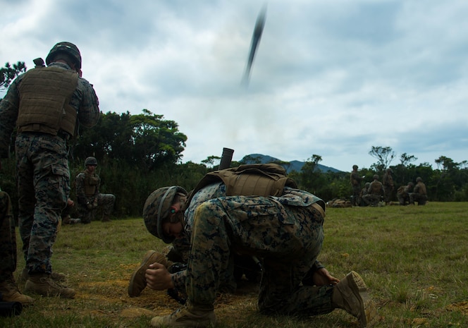 U.S. Marines with Tactical Readiness Training (TRT) Platoon, Combat Logistics Regiment 37, 3rd Marine Logistics Group, fire a 60 mm mortar round at Range 10, Camp Schwab, Okinawa, Japan on Feb. 26, 2019. TRT Platoon fired the M224 60 mm mortar system to maintain proficiency in order to remain combat ready for worldwide deployments. (U.S. Marine Corps photo by Lance Cpl. Isaiah Campbell)