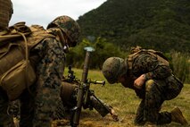 U.S. Marines with Tactical Readiness Training (TRT) Platoon, Combat Logistics Regiment 37, 3rd Marine Logistics Group, fire a 60 mm mortar round at Range 10, Camp Schwab, Okinawa, Japan on Feb. 26, 2019. TRT Platoon fired the M224 60 mm mortar system to maintain proficiency in order to remain combat ready for worldwide deployments. (U.S. Marine Corps photo by Lance Cpl. Isaiah Campbell)