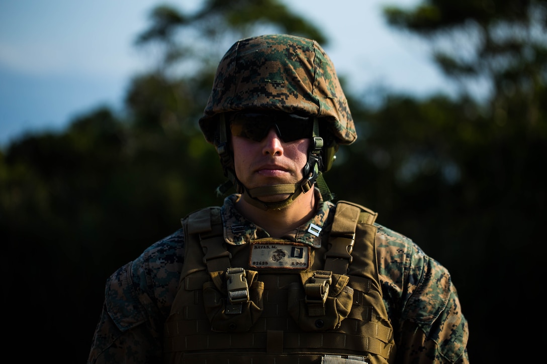 U.S. Marine Corps Capt. Moises E. Navas with Tactical Readiness Training (TRT) Platoon, Combat Logistics Regiment 37, 3rd Marine Logistics Group, prepares to fire a 60 mm mortar round at Range 10, Camp Schwab, Okinawa, Japan on Feb. 26, 2019. TRT Platoon fired the M224 60 mm mortar system to maintain proficiency in order to remain combat ready for worldwide deployments. (U.S. Marine Corps photo by Lance Cpl. Isaiah Campbell)