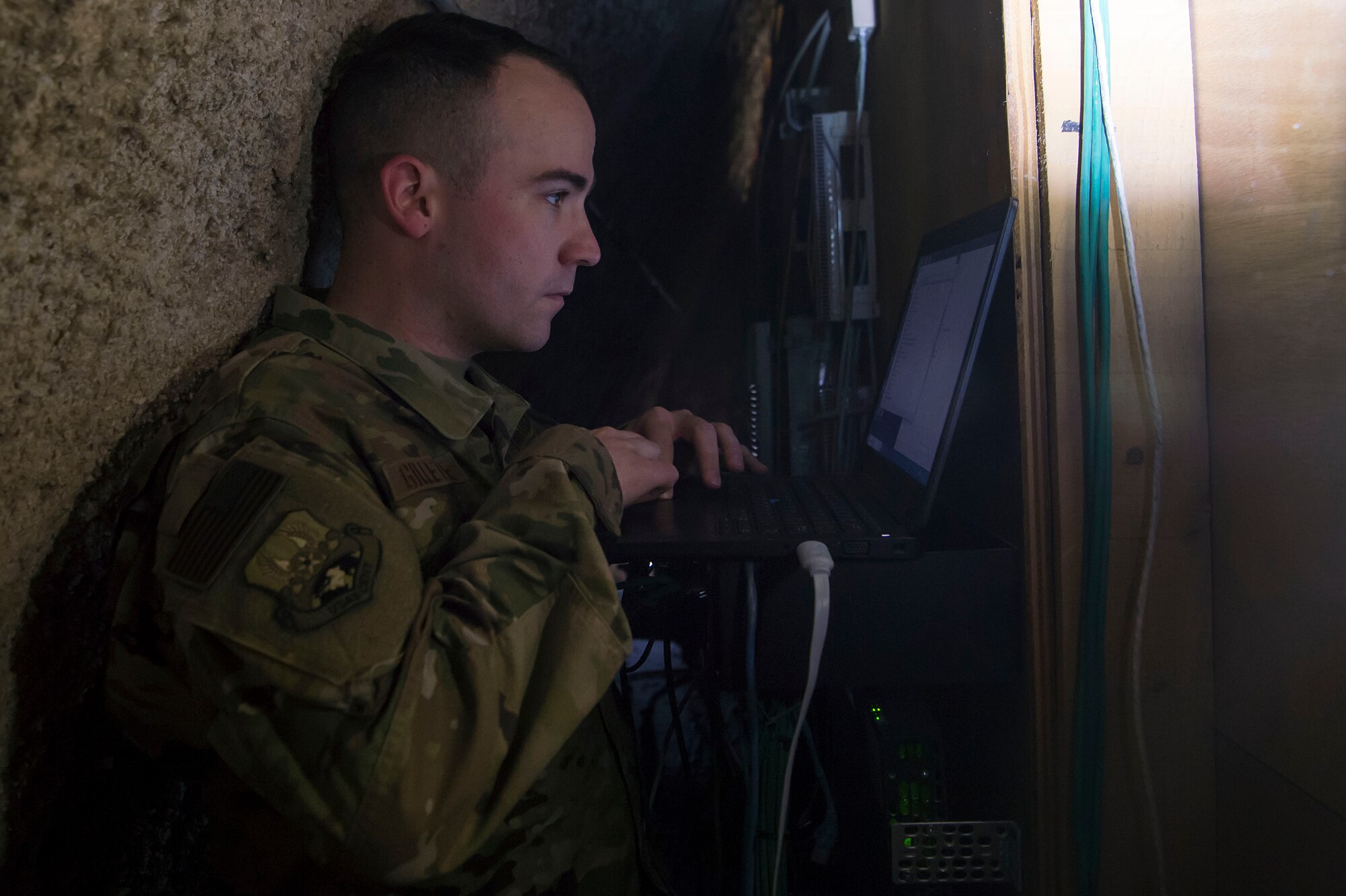Staff Sgt. Jason Gillette, 379th Expeditionary Communications Squadron (ECS) cyber transport technician, checks communications equipment for a coalition partner facility Feb. 8, 2019, at Al Udeid Air Base, Qatar. Gillette is part of a “beddown” team that enables power projection by establishing communications capabilities such as networks, Voice over Internet Protocol telephones, and radios from the ground up (U.S. Air Force photo by Tech. Sgt. Christopher Hubenthal)