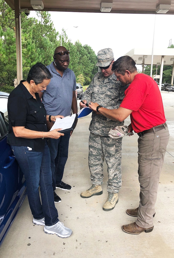 Rapid Deployment Team White members Maria Rodriquez (L) and Larry Lewis perform fuel truck accountability with DLA Energy and Foster Fuels representatives during reception operations at Simmons Army Airfield, North Carolina.