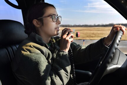 Senior Airman Sienna Krise, an airfield manager assigned to the Ohio Air National Guard’s 180th Fighter Wing, radios the Toledo Express Air Traffic Control Towner before driving on the airfield Feb. 21, 2019. Her role as an airfield manager is essential to the safety of the 180FW’s flying mission by ensuring that airfields are safe and clear of debris and wildlife, as well as confirming pilots meet all requirements necessary to fly.