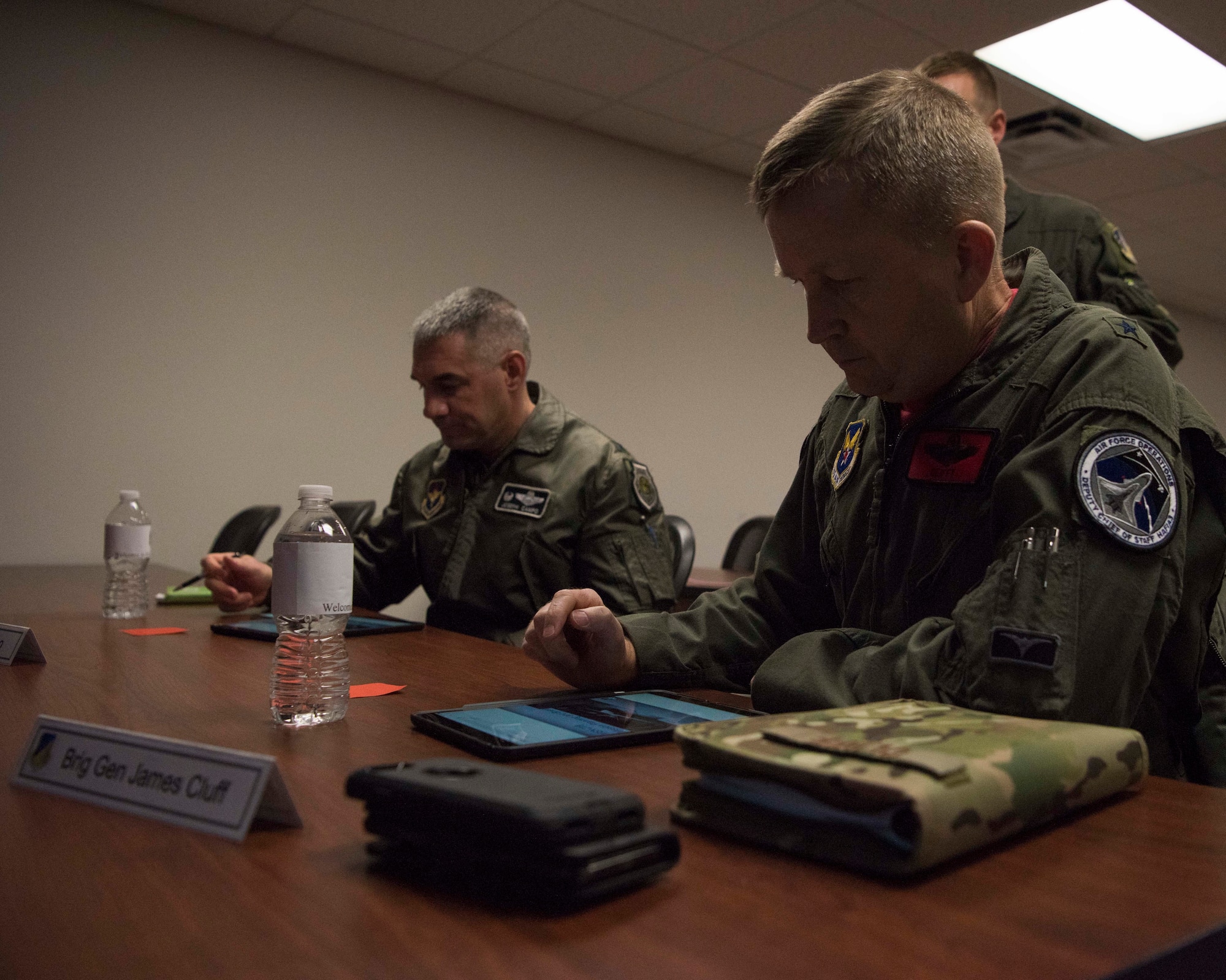 Brig. Gen. James Cluff, Remotely Piloted Aircraft, Big Wing Intelligence, Surveillance and Reconnaissance director and Col. Joseph Campo, 49th Wing commander, operate training prototypes, Feb. 8, 2019, on Holloman Air Force Base, N.M. The 16th Training Squadron, here, is conducting the MQ-9 Formal Training Unit Innovation project. The goal is to supplement bulky laptops with tablets that can be used by students in the classroom and in their dorm. (U.S. Air Force photo by Staff Sgt. BreeAnn Sachs)