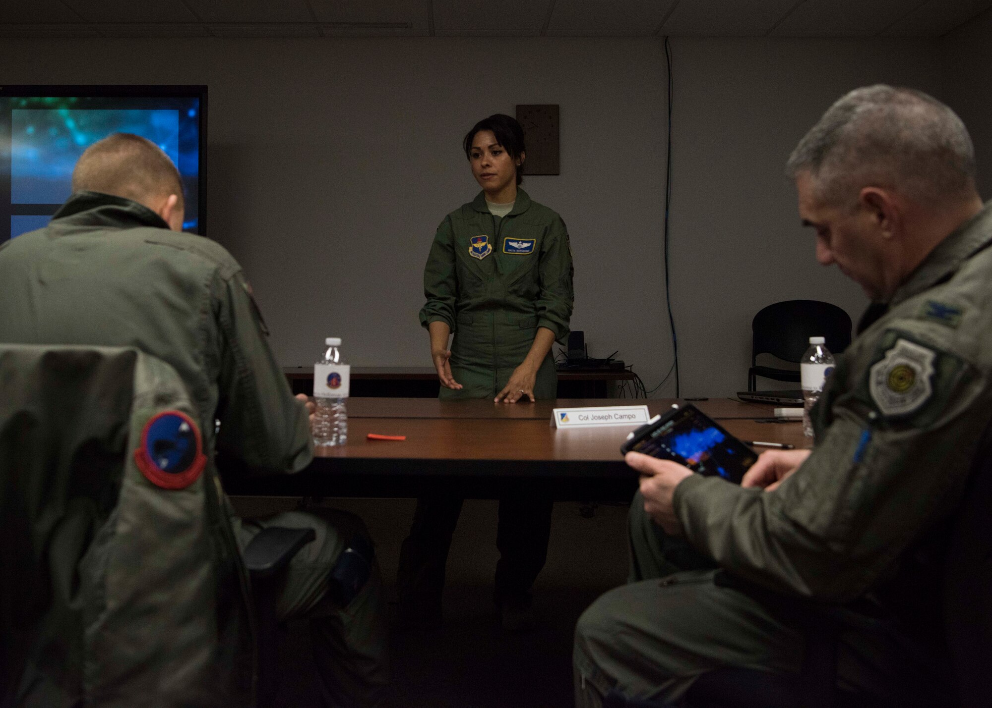 Maj. Nikita Wetherbee, 16th Training Squadron chief of training, briefs Brig. Gen. James Cluff, Remotely Piloted Aircraft, Big Wing Intelligence, Surveillance and Reconnaissance director and Col. Joseph Campo, 49th Wing commander, about the MQ-9 Formal Training Unit Innovation project, Feb. 8, 2019, on Holloman Air Force Base, N.M. The 16th TRS is conducting the experiment with the goal of modernizing their training platforms. (U.S. Air Force photo by Staff Sgt. BreeAnn Sachs)