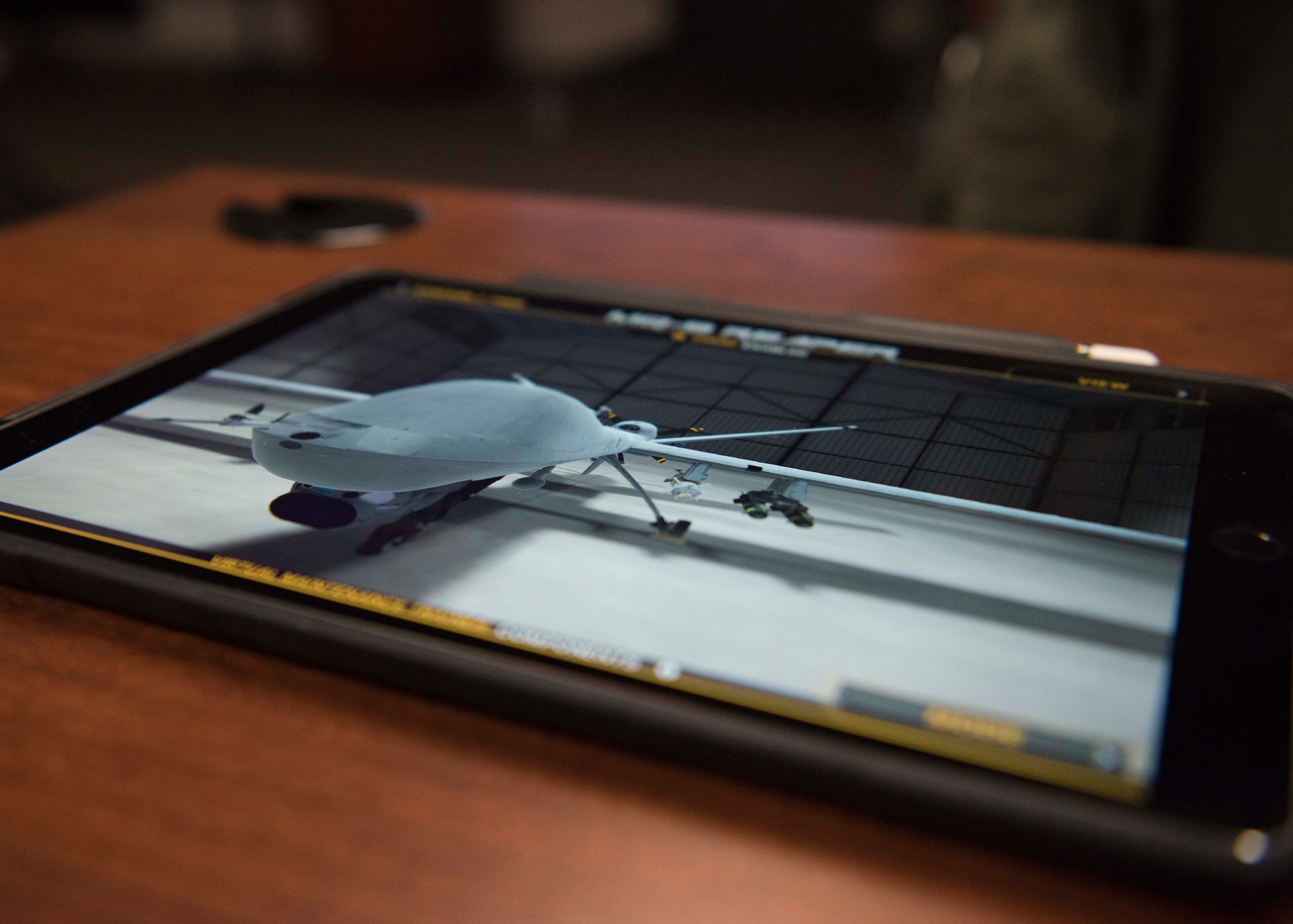A MQ-9 Reaper is displayed on a 16th Training Squadron Electronic Training Device prototype, Feb. 8, 2019, on Holloman Air Force Base, N.M. The 16th TRS, here, is conducting a MQ-9 Formal Training Unit Innovation project, with the goal of supplementing bulky laptops with tablets that can be used by students in the classroom and in their dorm. (U.S. Air Force photo by Staff Sgt. BreeAnn Sachs)