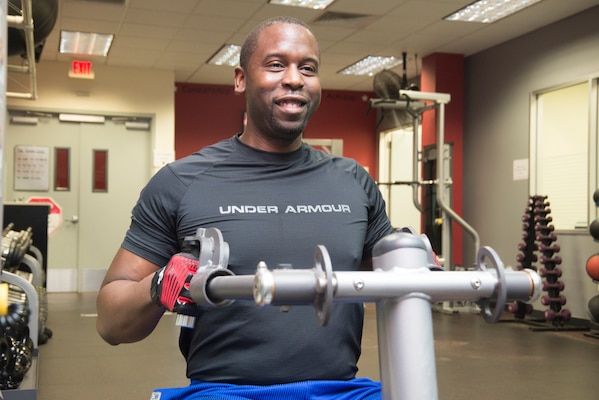 Robert Jackson, mechanical engineer and chairperson of Huntsville Center’s Wellness Committee, targets his trapezius muscles during a workout in the Center’s newly opened gym.