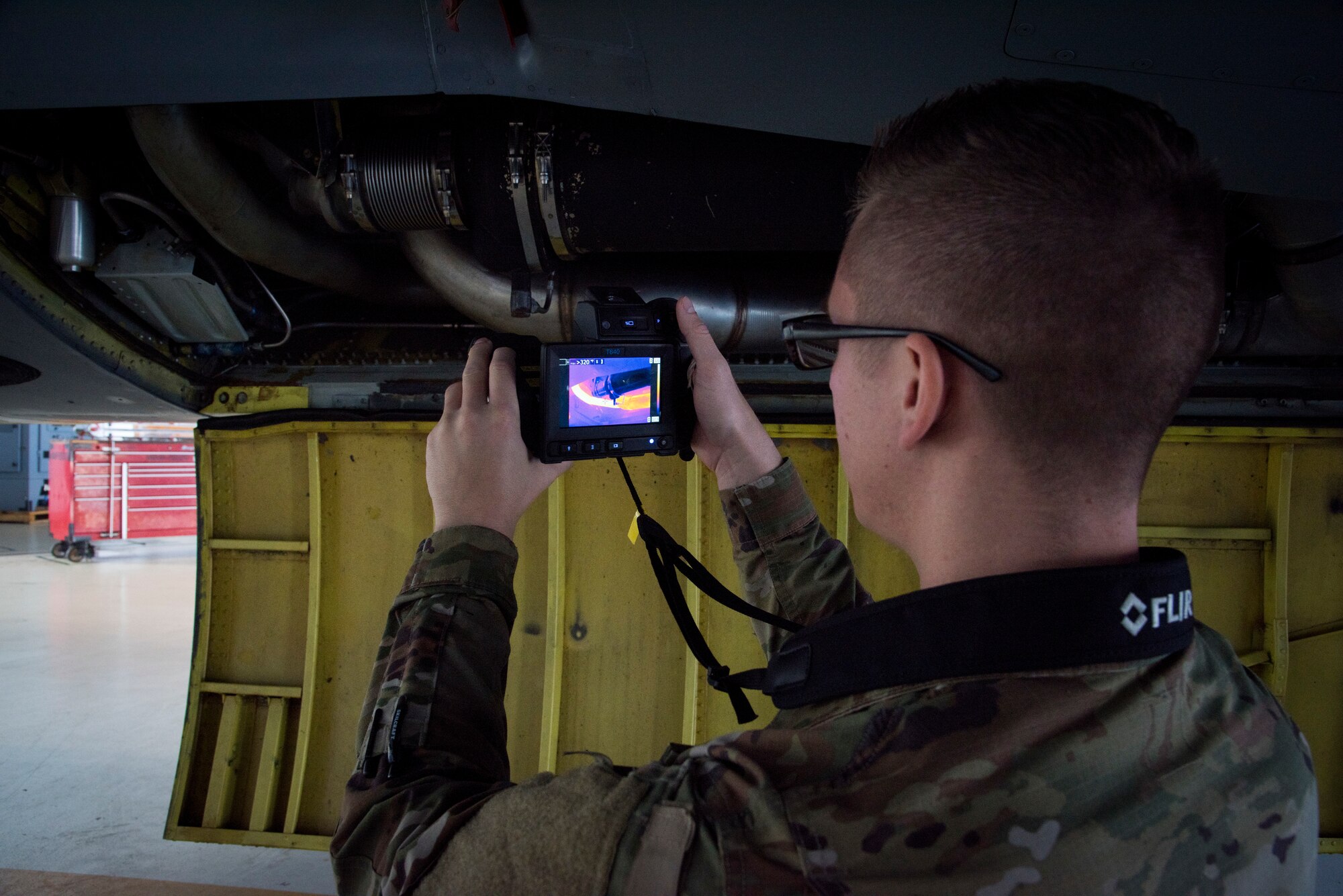 U.S. Air Force Staff Sgt. James Morin, a 6th Aircraft Maintenance thermography certified technician, takes a thermal image of a bleed air duct at MacDill Air Force Base, Fla., March 1, 2019.