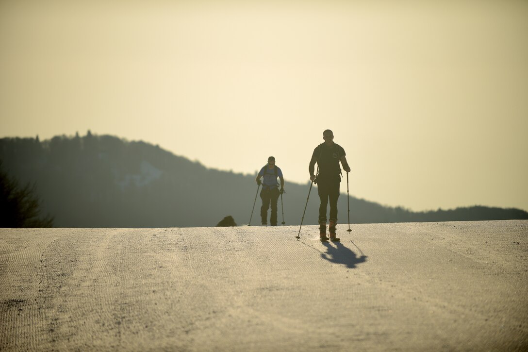 Pararescuemen from the 57th Rescue Squadron climb a ski slope for unit physical training in Piancavallo, Italy, Feb. 28, 2019. The Airmen attached clamps to their skis that allowed them to hike up the mountain. (U.S. Air Force photo by Staff Sgt. Tory Cusimano)