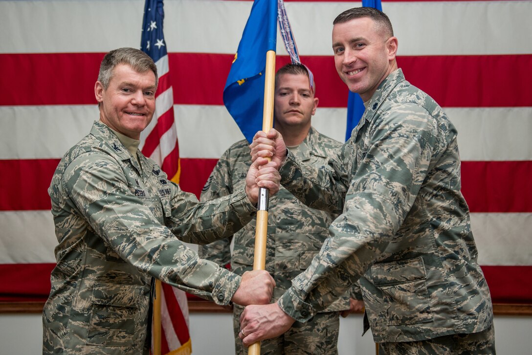 Lt. Col. Ryan Robin assumes command of the 512th Mission Support Group during a ceremony officiated by Col. Craig Peters, 512th Airlift Wing commander, at Dover Air Force Base, Delaware, March 2, 2019. Robins is responsible for a 650-person organization, which supports Air Mobility Command’s worldwide airlift mission. (U.S. Air Force photo by Staff Sgt. Damien Taylor)
