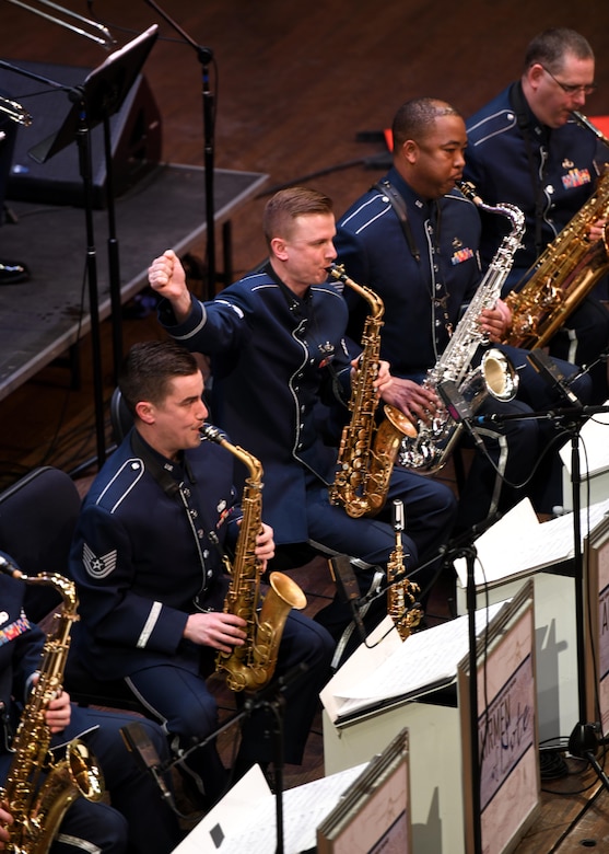 Tech. Sgt. Kristian Baarsvik, U.S. Air Force Band’s Airmen of Note lead alto saxophone player, gives a hand command during the Jazz Heritage Series, Feb. 22, 2019 in Alexandria, Va. Hand gestures are often used to signal a stop in which everyone can be on the same queue and stop together. (U.S. Air Force photo by Senior Airman Alyssa D. Van Hook)