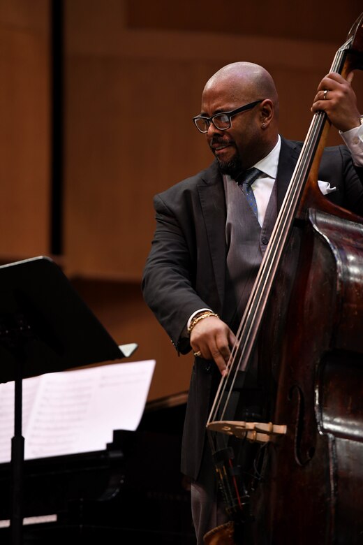 Christian Mcbride, guest double bassist, performs during the Jazz Heritage Series, Feb. 22, 2019 in Alexandria, Va. This series featured original jazz compositions as well as big band classics with guest double bassist Christian McBride. (U.S. Air Force photo by Senior Airman Alyssa D. Van Hook)
