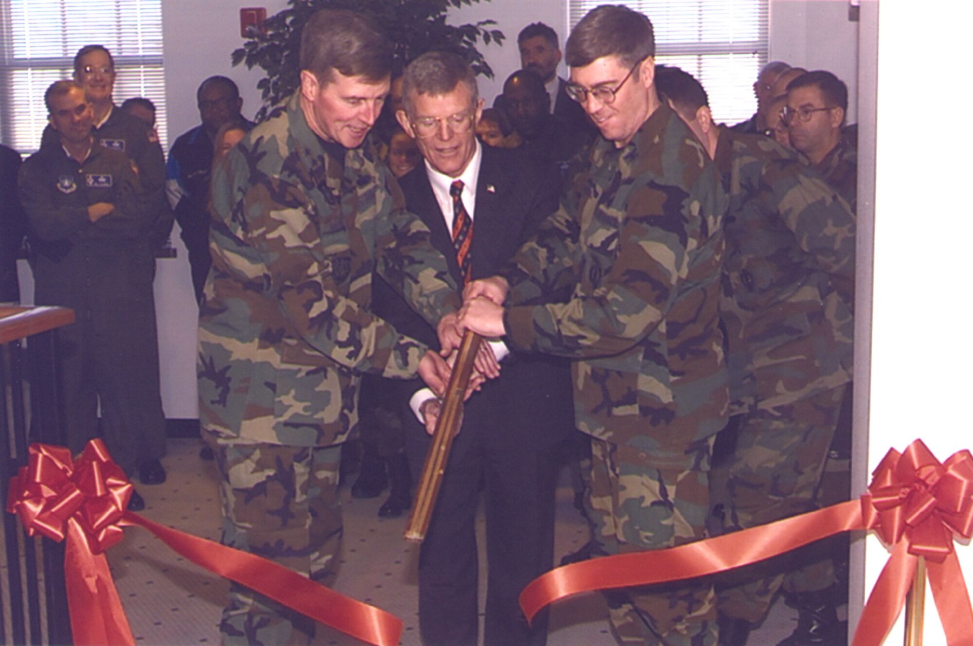 In a historical archive photo dating back to Mar. 26, 2002, Maj. Gen. Robert McMahon, 20th Air Force Commander, Maj. Gen. (retired) Thomas Neary, 20th Air Force Commander, and Col Shearer, 90th Missile Wing Commander cut the ribbon to open the ICBM Center of Excellence on F. E. Warren AFB, Wyo. (Courtesy photo)