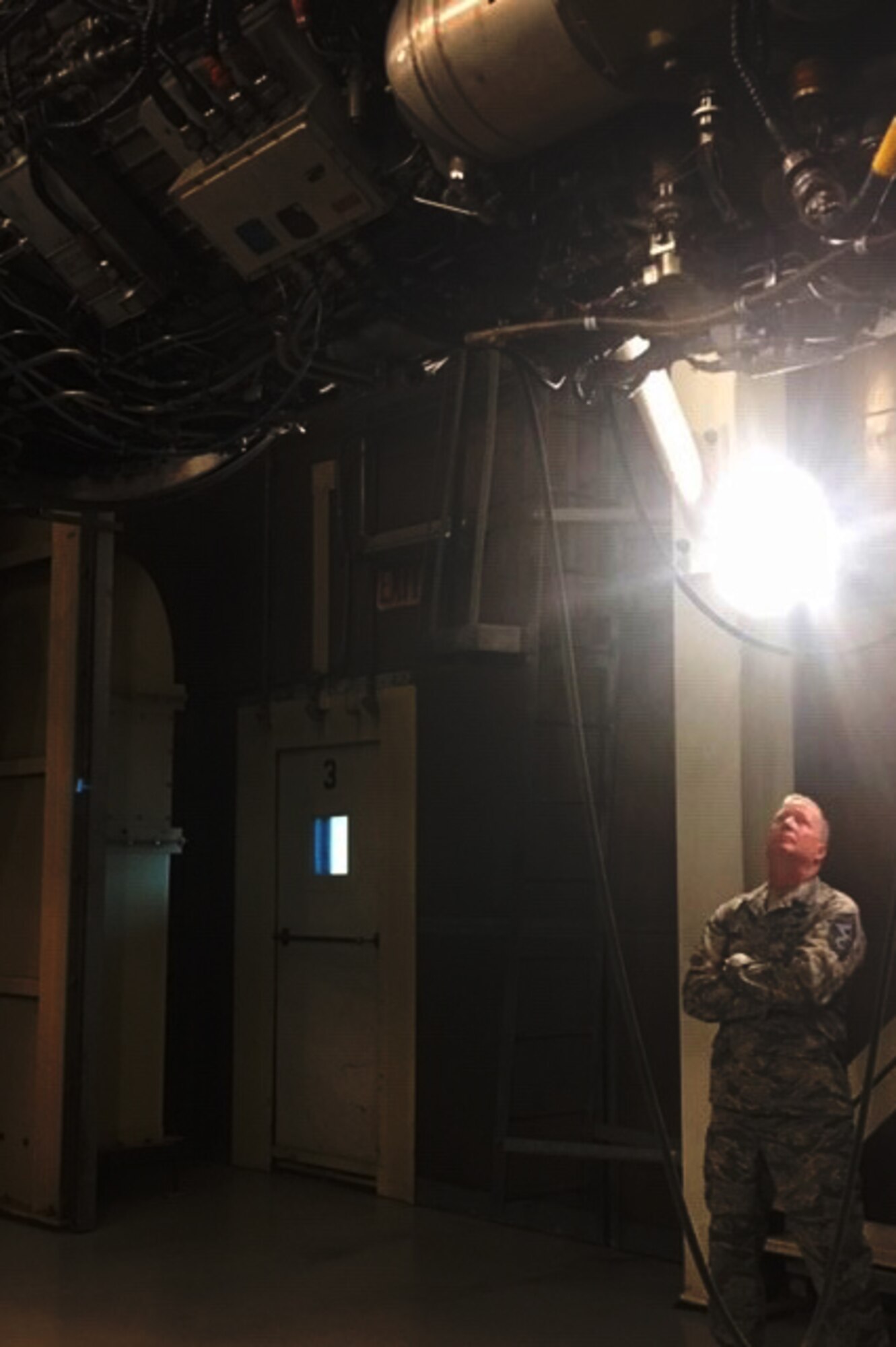 U.S. Air Force Command Chief Master Sgt. Darren Demel, 307th Bomb Wing command chief, views the internal workings of a B-1 Lancer engine at Dyess Air Force Base, Texas, March 1, 2019.  Demel was visiting the 489th Bomb Group, a geographically separated unit of the 307th Bomb Wing, during their unit training assembly. (courtesy photo)