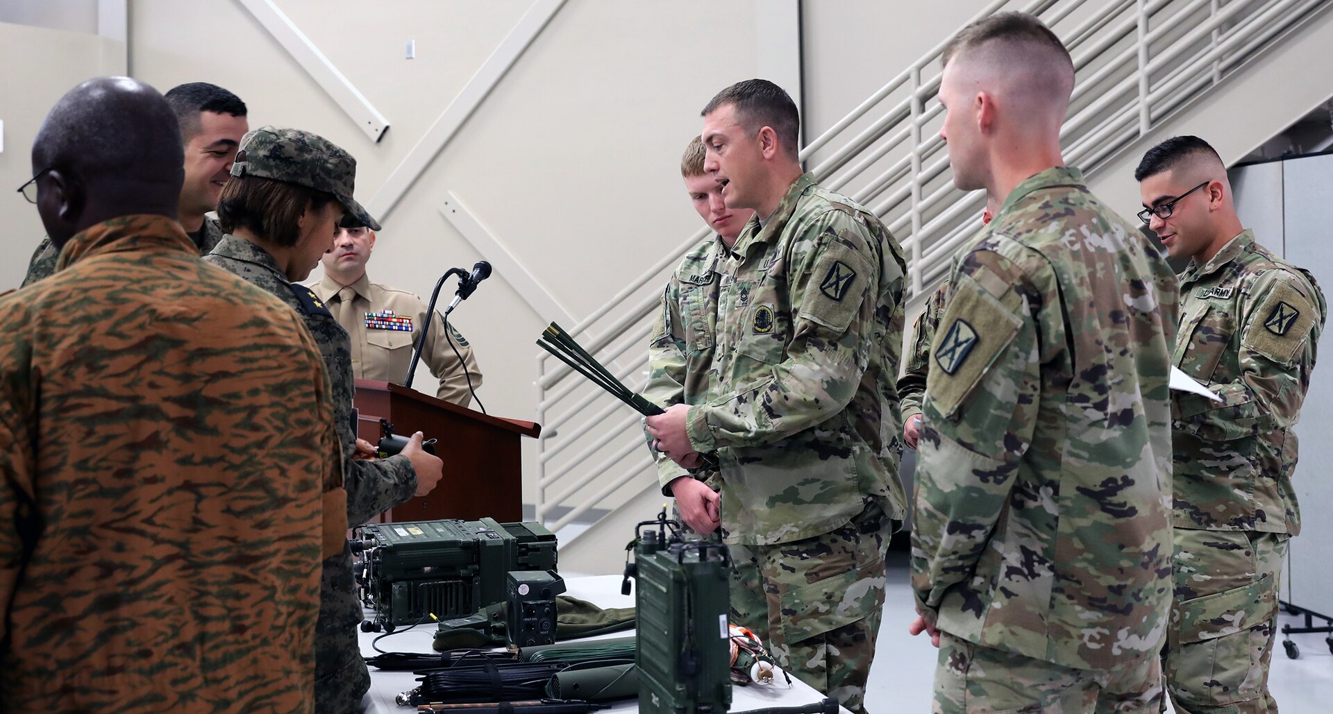 Sgt. 1st Class Andrew Wiswell shows officers and senior non-commissioned officers from the U.S. Africa Command area of responsibility different radio components during the 2019 Junior Communications Symposium at Joint Base San Antonio-Fort Sam Houston Feb. 25.