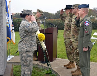 (From left) Col. Peter Velesky, Joint Base San Antonio deputy commander and 502nd Air Base Wing vice commander; Col. Samuel Fiol, 502nd Force Support Group commander; and Lt. Col. Emil Bliss, 12th Operations Group chief of standardization and evaluation at JBSA-Randolph, salute after laying a wreath commemorating the 109th anniversary of the first military flight by Army Maj. Gen. Benjamin Foulois at the JBSA-Fort Sam Houston Flag Pole March 1.