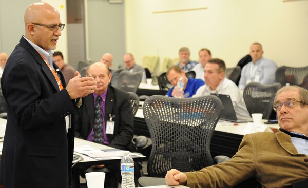 Karim Manji, Installation Management Command Sustainment speaks to Huntsville Center's Resource Efficiency Managers gatherd at the Center Feb. 28.