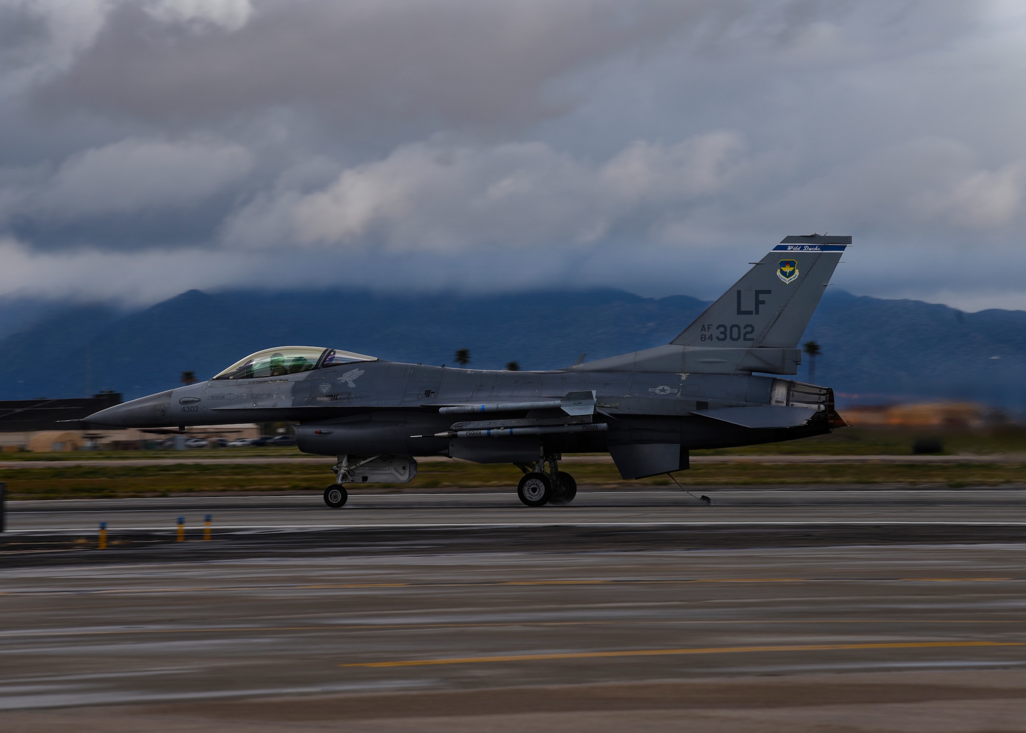 An F-16A Fighting Falcon prepares to catch the emergency cable of the BAK-12 arresting system during an annual drill at Luke Air Force Base, Ariz., Feb. 22, 2019.
