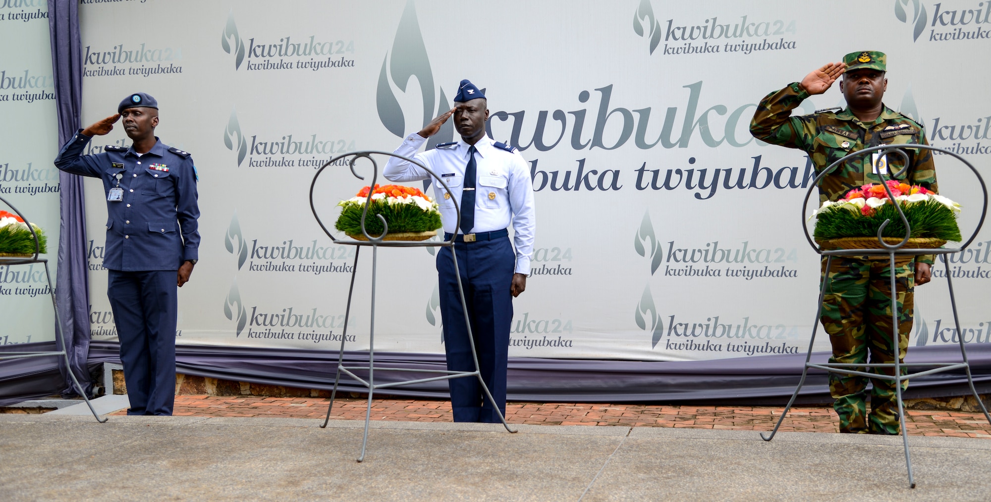 Rwanda Air Force Capt. Emmanuel Rutebuka, left, U.S. Air Force Col. Stephen Hughes, center, and Ghana Air Force Squadron Leader Ishmael Ansah render salutes during a wreath laying ceremony at the Kigali Genocide Memorial in Kigali, Rwanda, March 4, 2019. The ceremony was part of a cultural visit for the African Partnership Flight Rwanda. (U.S. Air Force photo by Tech. Sgt. Timothy Moore)