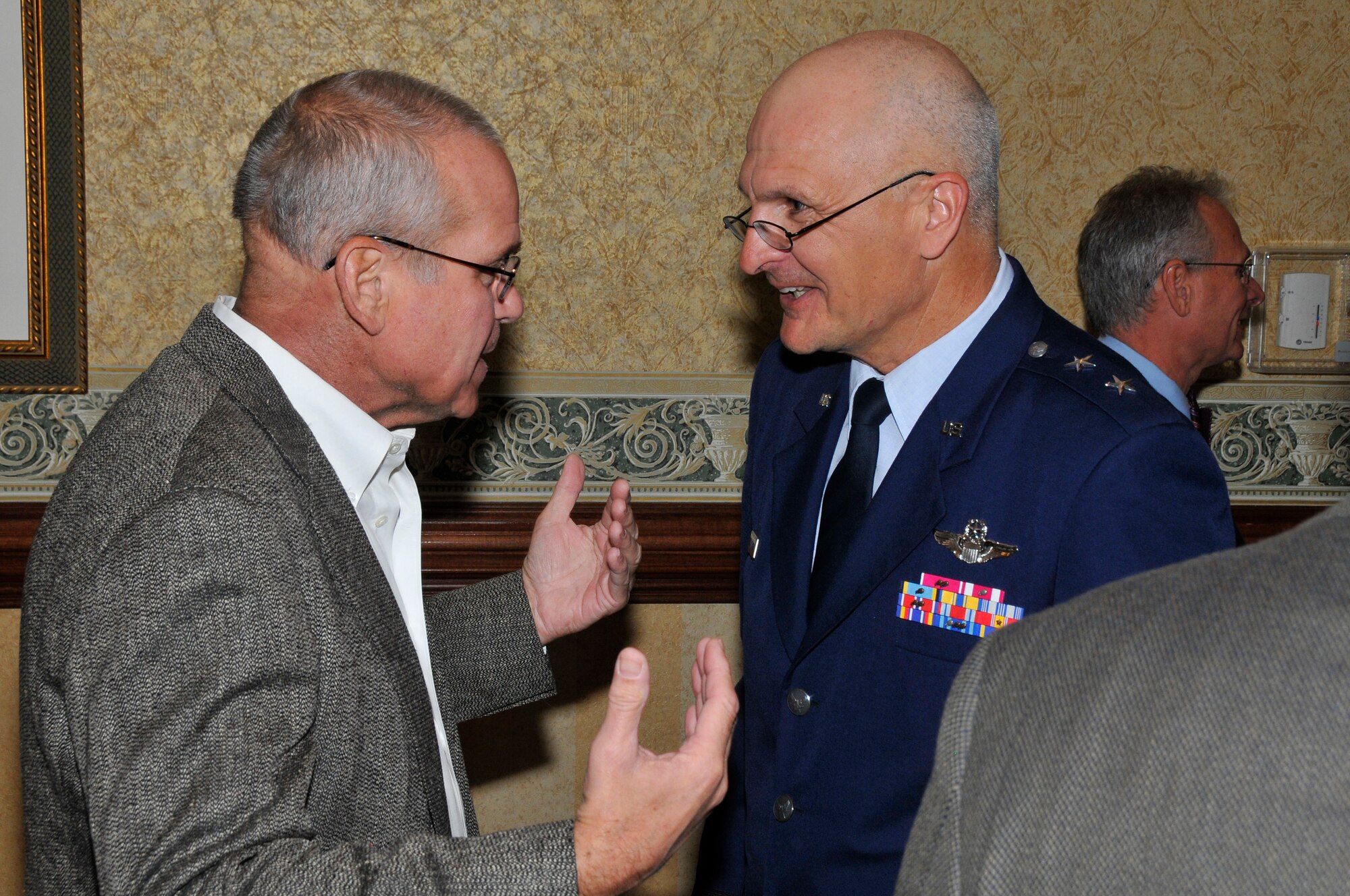 Lt. Gen. Arnold Bunch, right, talks with Arnold Community Council member, Mike Niederhauser, after the general’s speech to several hundred council members as part of the ACC Annual Banquet.