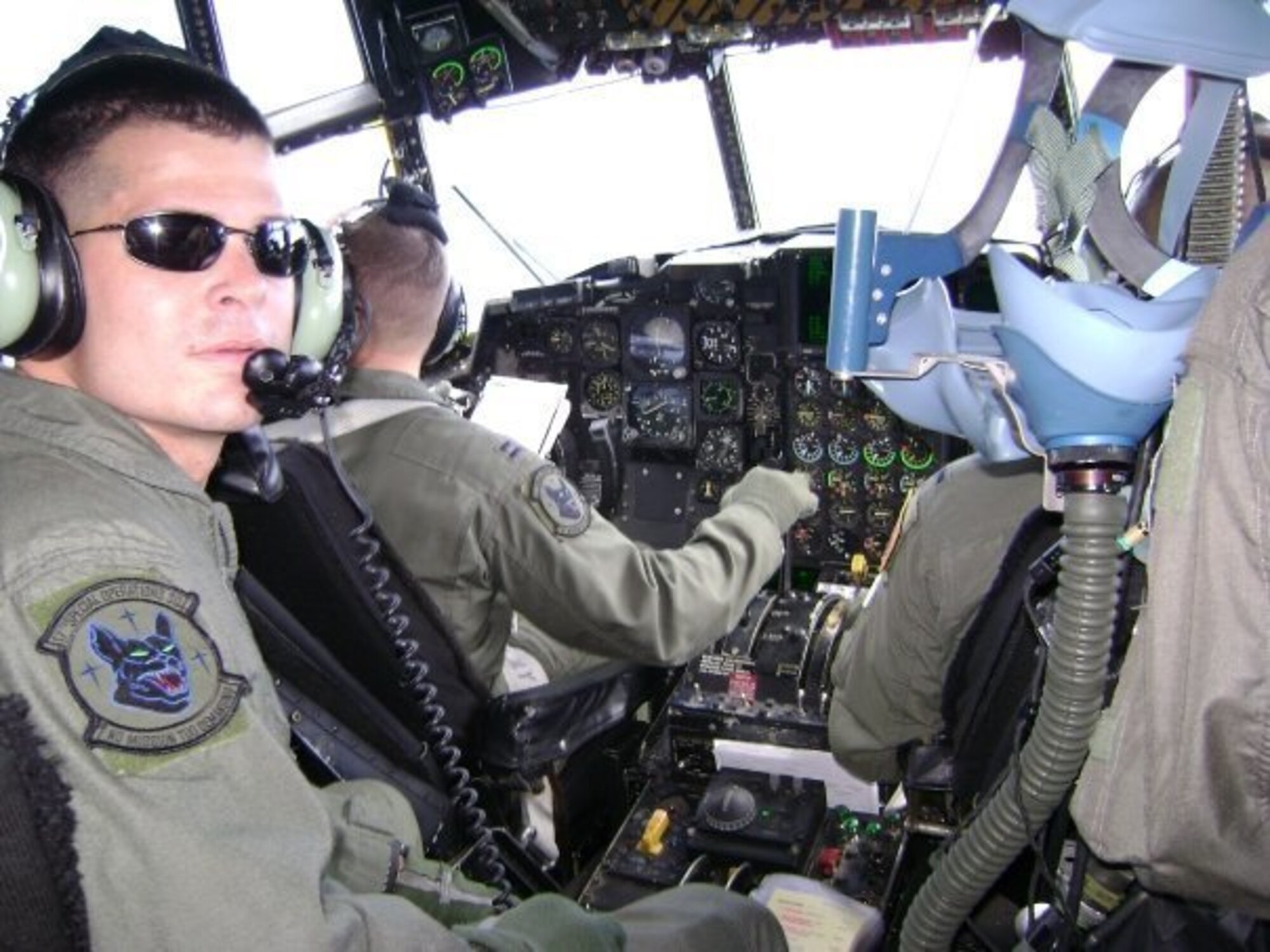 U.S. Air Force Chief Master Sgt. Tony Jenkins, 33rd Operations Group superintendent, pictured as a Staff Sgt., sits in the flight deck of an MC-130 during a local training sortie May 2005, near Japan. After spending several years as an aircraft communication and navigation systems specialist, Jenkins cross-trained to become a flight engineer. (Courtesy photo)