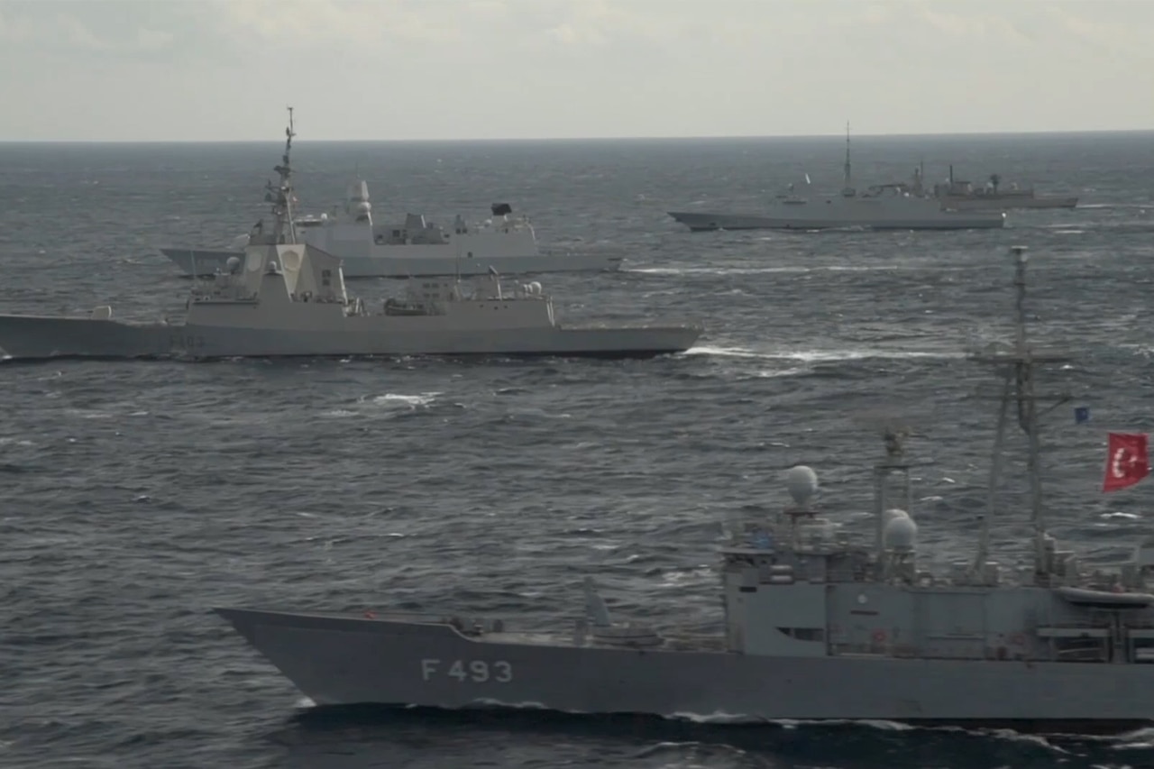 NATO ships hunt submarines.