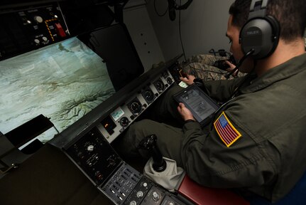 Airman 1st Class Nicholas Eddings, 32nd Air Refueling Squadron KC-10 Extender boom operator, reads his checklist during a simulated refueling mission on Joint Base McGuire-Dix-Lakehurst, New Jersey, Dec. 19, 2018. Each student must follow a checklist to properly operate the aircraft. (U.S. Air Force photo by Airman 1st Class Ariel Owings)