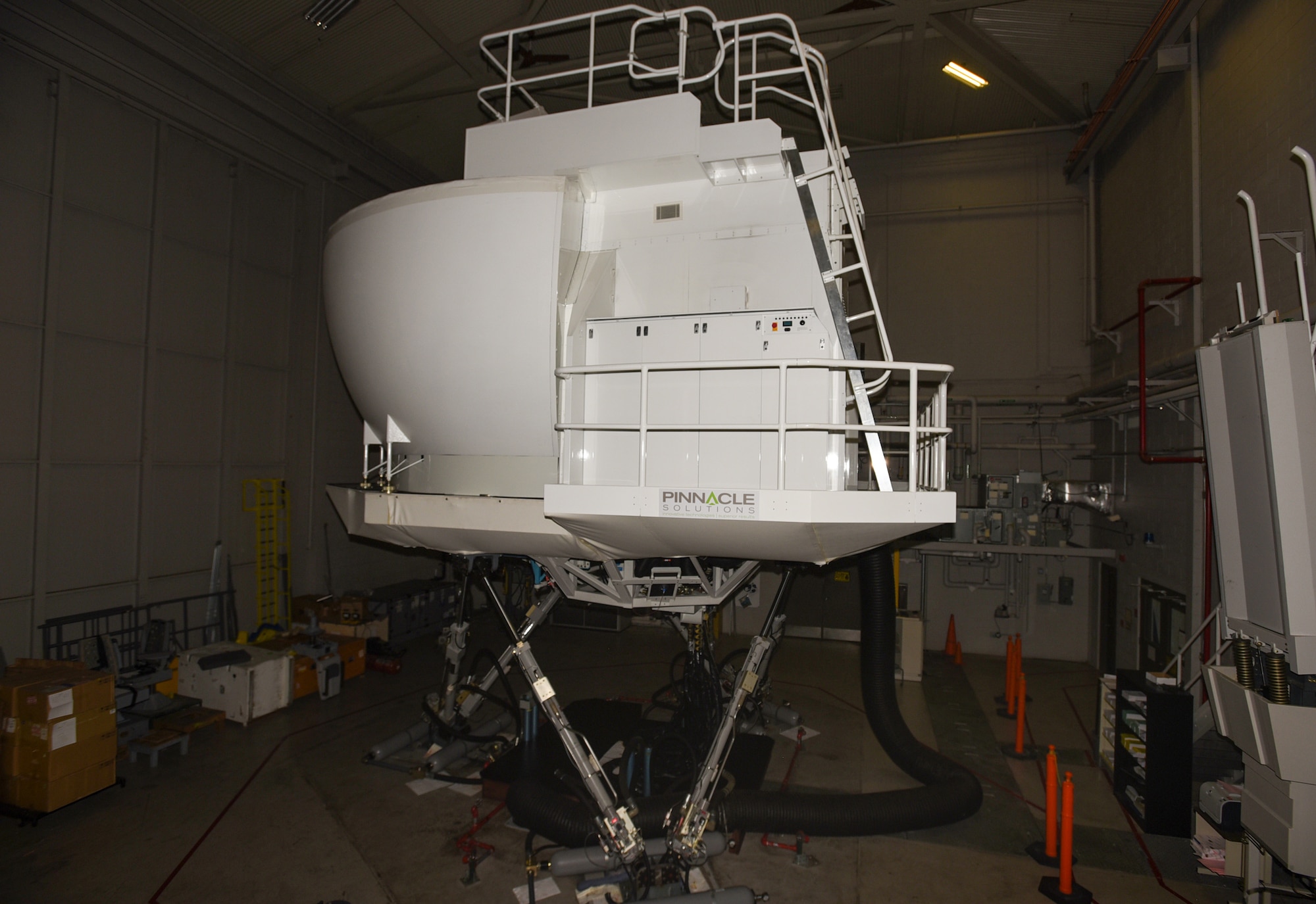 A Pinnacle Solutions simulator sits in the KC-10 Extender aircrew training simulator facility on Joint Base McGuire-Dix-Lakehurst, New Jersey, Dec. 19, 2018. The facility provides experienced instructors to train Airmen on simulators before operating an aircraft. (U.S. Air Force photo by Airman 1st Class Ariel Owings)