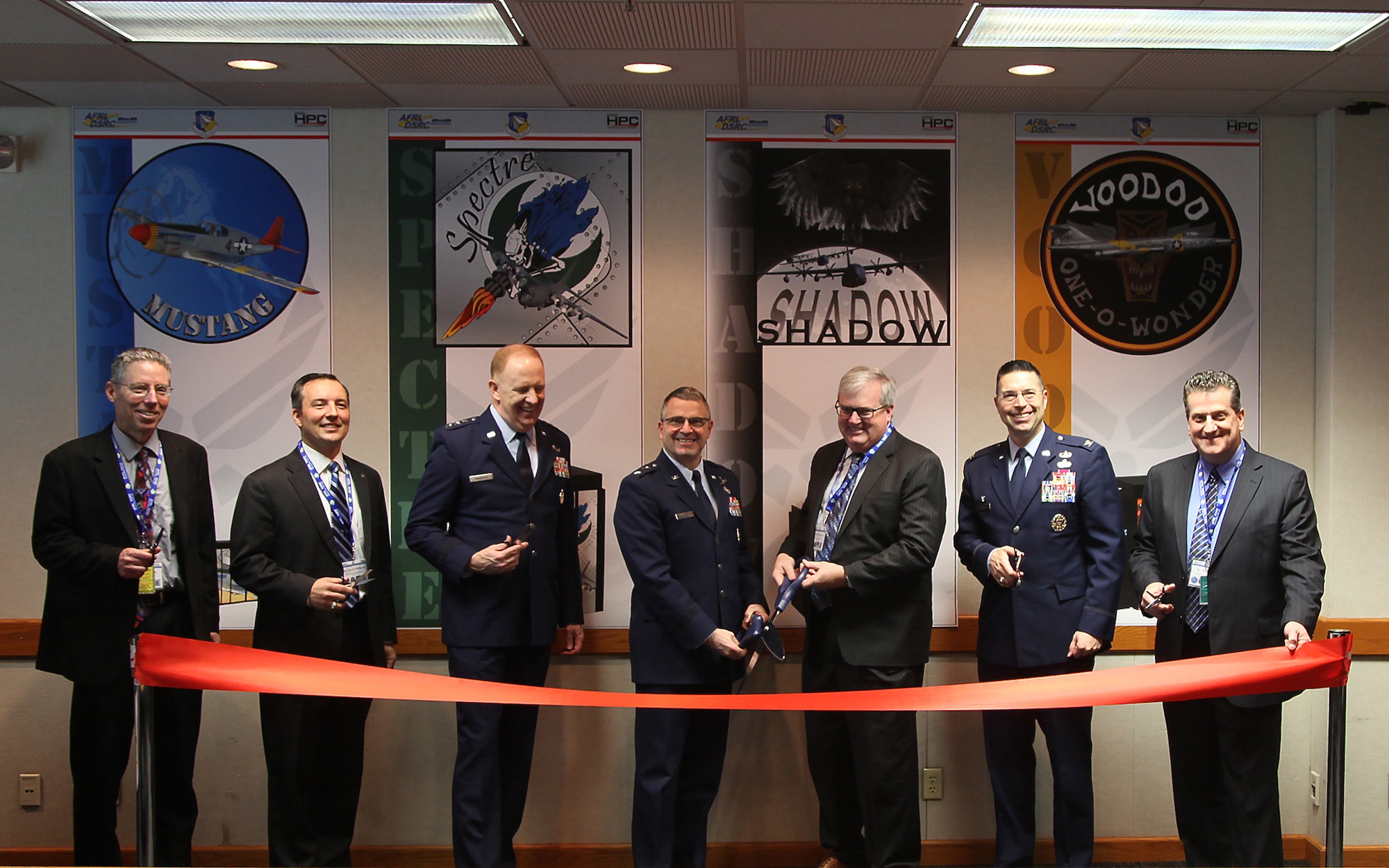 Members of Wright-Patterson Air Force Base and Department of Defense leadership cut the ribbon for a new DOD super computer capability located at Wright-Patterson Air Force Base, Ohio, Feb. 26. This is the first-ever shared classified Department of Defense high performance computing capability. (Courtesy photo)