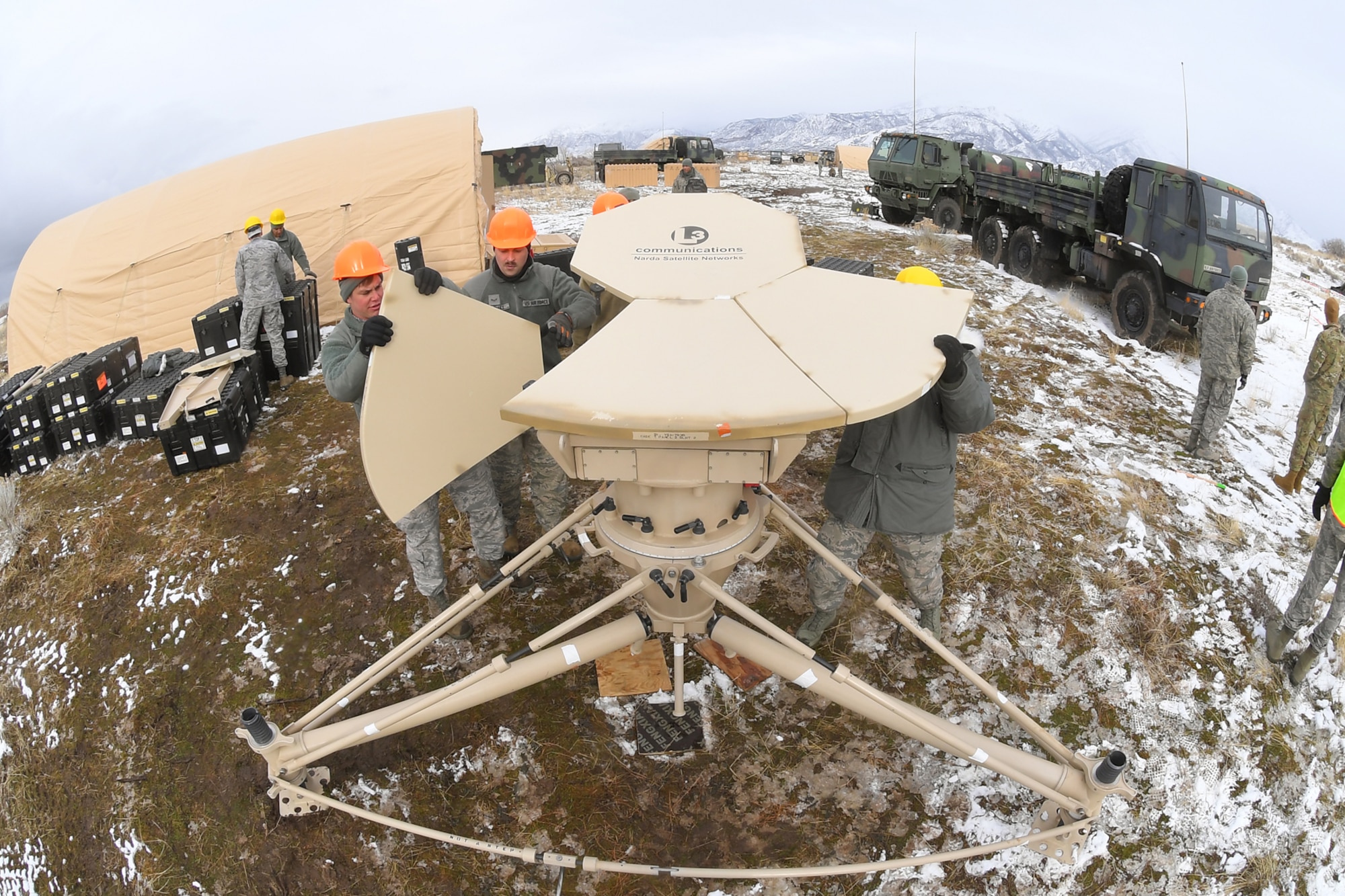 Airmen with the 729th Air Control Squadron set up a communications antenna Feb. 5, 2019, during a readiness exercise at Hill Air Force Base, Utah. The evolution was part of an exercise to mobilize and set up a deployed radar location and control reporting center. (U.S. Air Force photo by Todd Cromar)