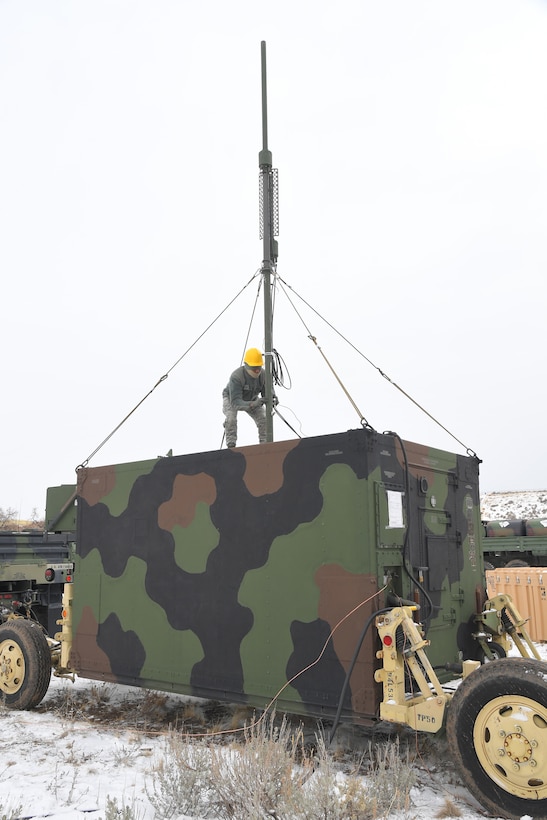 Airman 1st Class Deonte Washington, 729th Air Control Squadron, sets up a communications antenna Feb. 6, 2019, during a readiness exercise at Hill Air Force Base, Utah. The evolution was part of an exercise to mobilize and set up a deployed radar location and control reporting center. (U.S. Air Force photo by Todd Cromar)