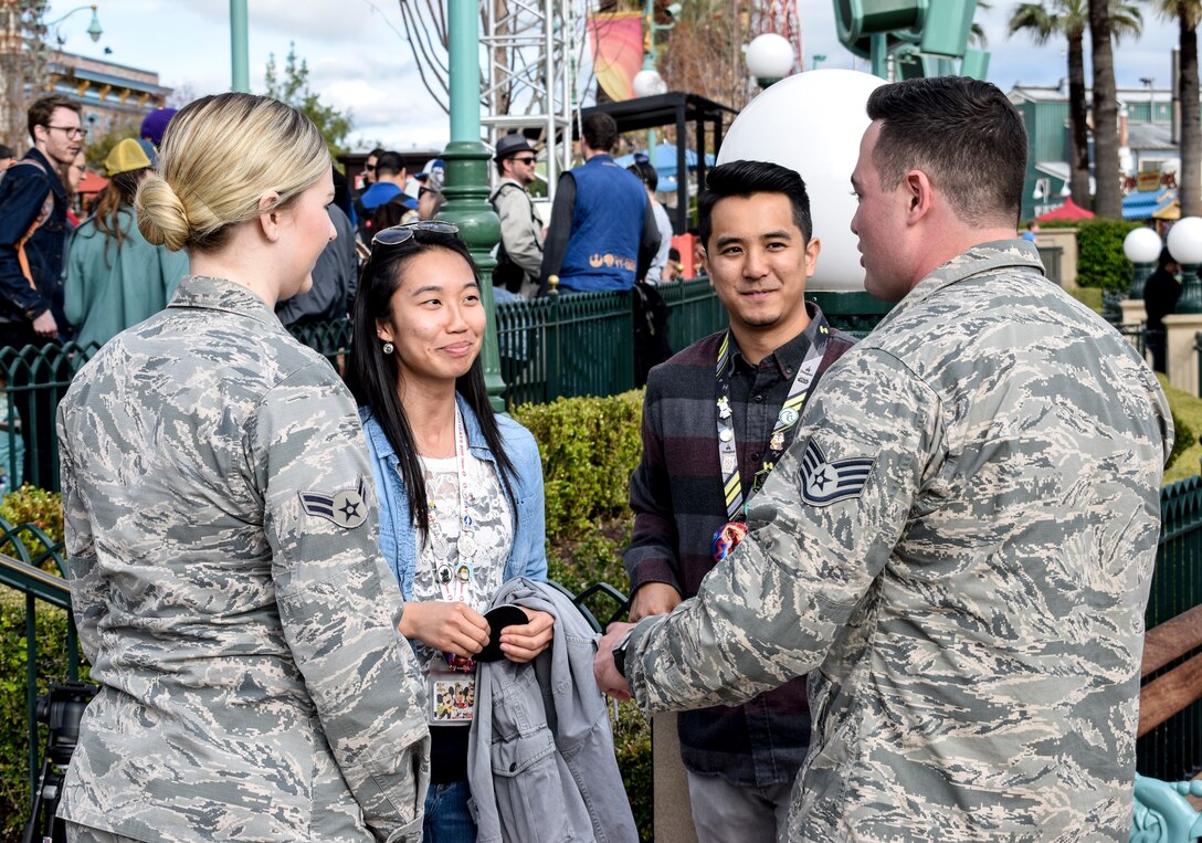 Airmen from the 144th Fighter Wing speak with guests at Disney California Adventure Park in Anaheim, Calif., March 3, 2019.