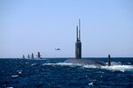 USS Santa Fe (SSN 763) joins Collins Class Submarines, HMAS Collins, HMAS Farncomb, HMAS Dechaineux and HMAS Sheean in formation while transiting through Cockburn Sound, Western Australia.