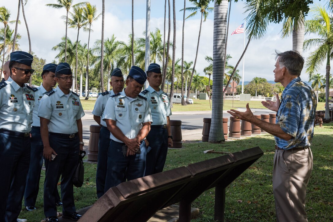 Members of the Philippine air force (PAF) receive a historical tour from Charles Nicholls, Pacific Air Forces (PACAF) historian, at the PACAF Headquarters building, Joint Base Pearl Harbor-Hickam, Hawaii, Feb. 25, 2019.