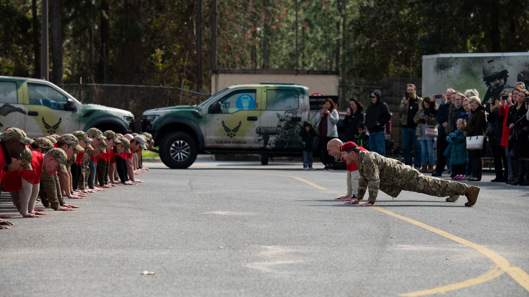 Special Tactics senior leaders with the 24th Special Operations Wing lead hundreds of Air Commandos, teammates and family in performing memorial push-ups following the Special Tactics Ruck March Memorial Ceremony at Hurlburt Field, Florida, March 4, 2018.