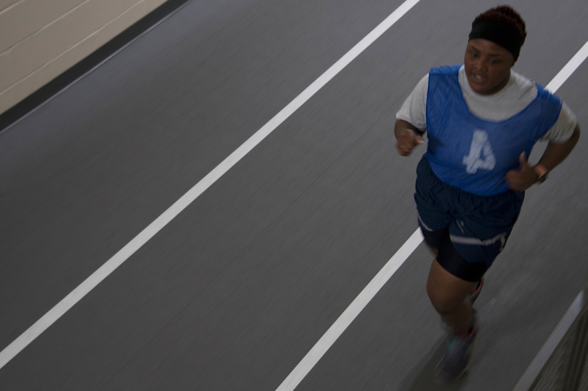 Senior Airman Decaqunita Forte, assigned to the 307th Medical Squadron, completes the run portion of the Air Force physical fitness assessment at Barksdale Air Force Base, Louisiana, February 10, 2019. Physical fitness assessments are one  tool used in measuring an Airman’s overall resiliency. (U.S. Air Force photo by Airman 1st Class Maxwell Daigle)