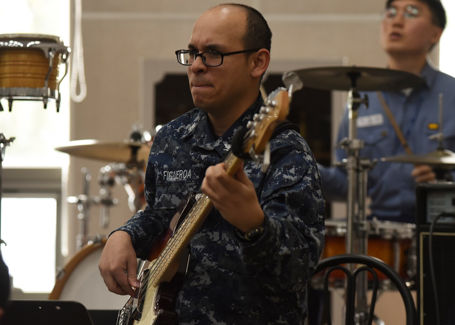 Musician 3rd Class Jose Figueroa plays the bass during a music exchange with Sailors from the Republic of Korea during a port visit to Busan, South Korea. Blue Ridge, with embarked 7th Fleet staff, is on its first patrol in over two years, strengthening relationships with U.S. allies and partner nations while providing advanced communication capabilities and supporting Theater Security Cooperation across the Indo-Asia Pacific region.