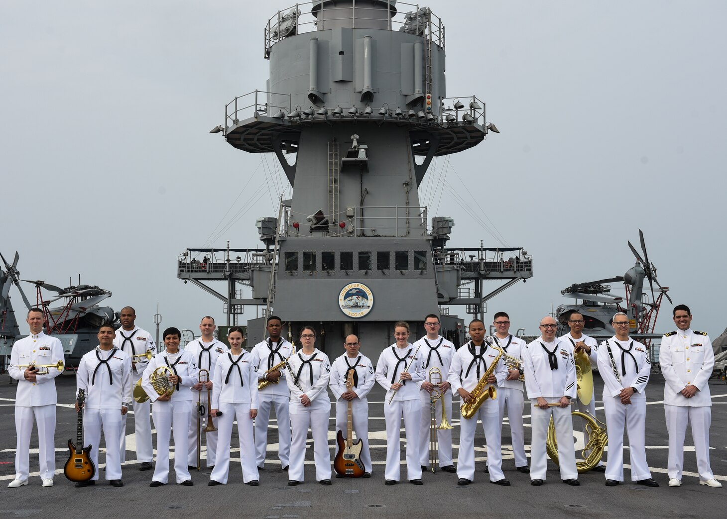 Sailors from the U.S. 7th Fleet Band poses for a picture while aboard the littoral command and control ship USS Blue Ridge (LCC 19). Blue Ridge, with embarked 7th Fleet staff, is on its first patrol in over two years, strengthening relationships with U.S. allies and partner nations while providing advanced communication capabilities and supporting Theater Security Cooperation across the Indo-Asia Pacific region.