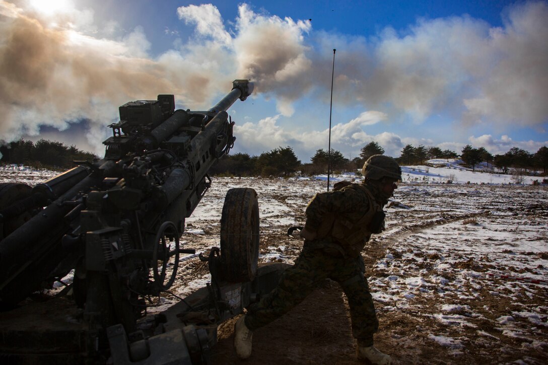 U.S. Marine Corps Lance Cpl. Johnathan Delgado, a field artillery Marine with 3rd Battalion, 12th Marine Regiment, 3rd Marine Division, fires a M777 Howitzer in the Ojojihara Maneuver Area, Miyagi Prefecture, Japan, Feb. 10, 2019. Marines with 3/12 are training in the Ojojihara Maneuver Area as part of the Artillery Relocation Training Program 18-4. ARTP is a routine training exercise that allows Okinawa-based Marines to conduct live-fire training in Japan. (U.S. Marine Corps photo by Lance Cpl. Christian Ayers)
