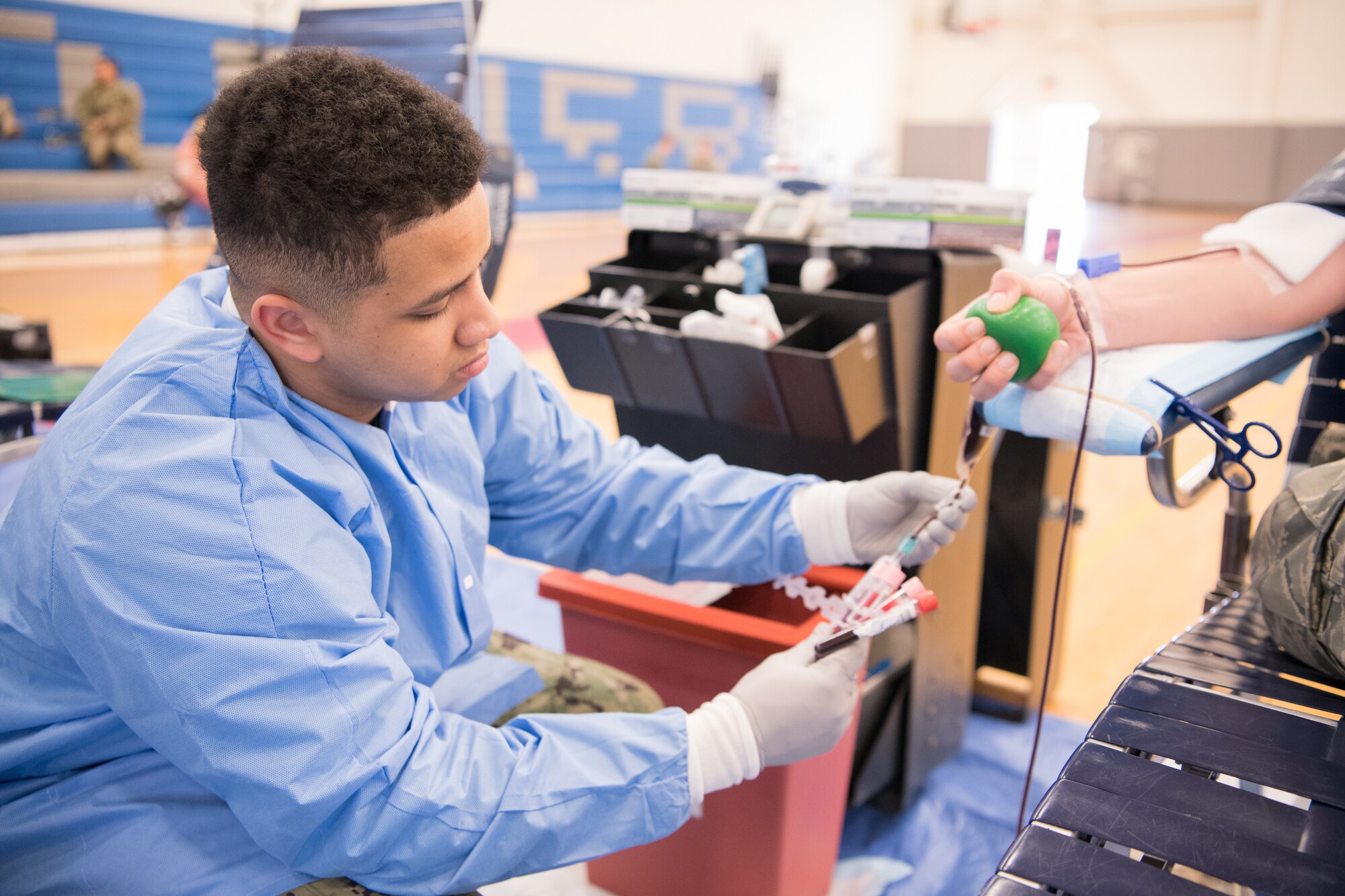 Hospital Apprentice Isaiah Burns, Walter Reed National Medical Center, collects vials of blood from a donor at the Armed Services Blood Program blood drive Feb. 28, 2019, at Dover Air Force Base, Del. The vials of blood will be screened for various blood-borne diseases before the donor’s blood is cleared for use. (U.S. Air Force Photo by Mauricio Campino)