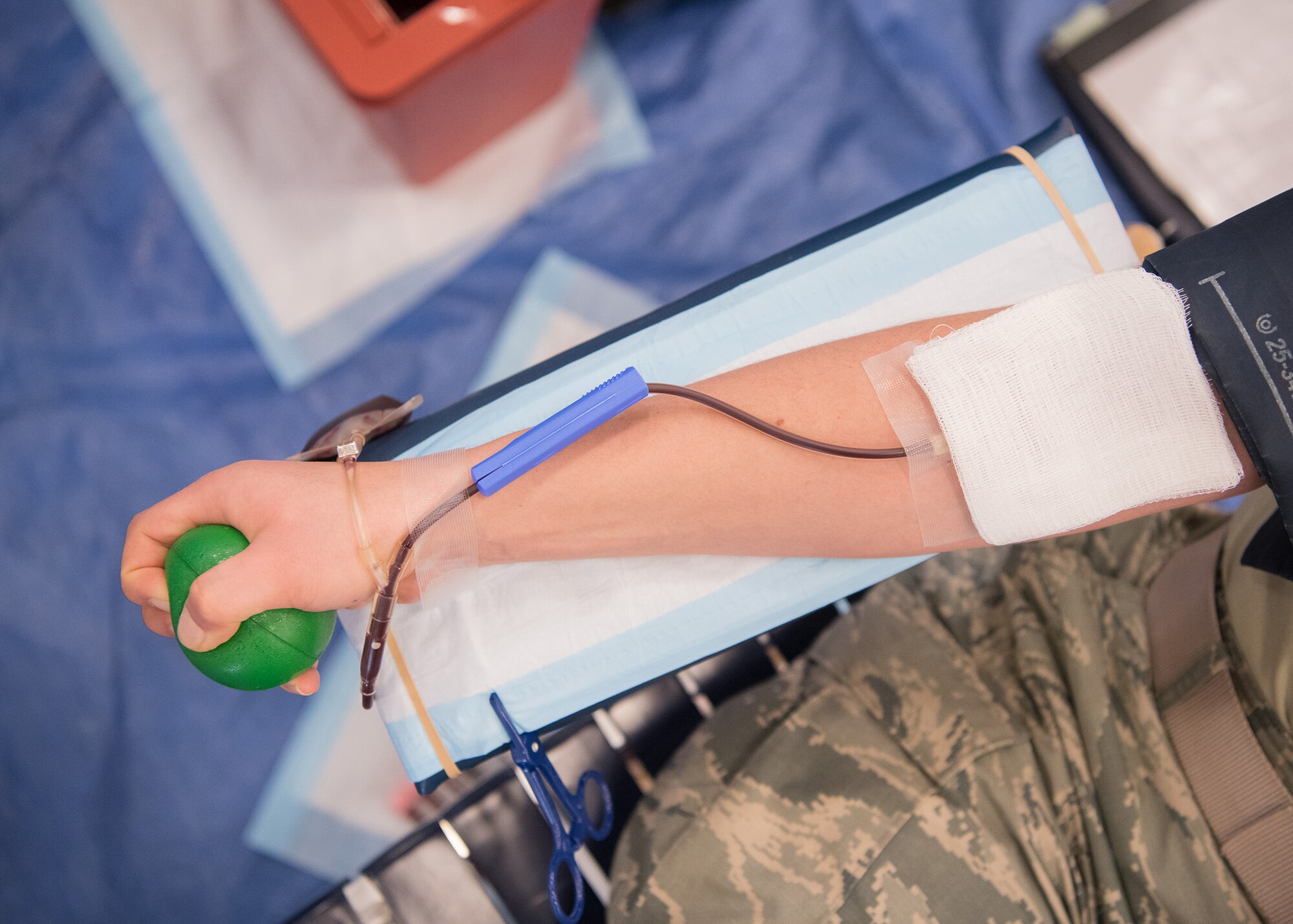 A Team Dover Airman donates blood at the Armed Services Blood Program blood drive Feb. 28, 2019, at Dover Air Force Base, Del. Donated blood is processed off-site, and some of it will be brought back to Dover AFB to be shipped out for aid in military and humanitarian missions. (U.S. Air Force photo by Mauricio Campino)