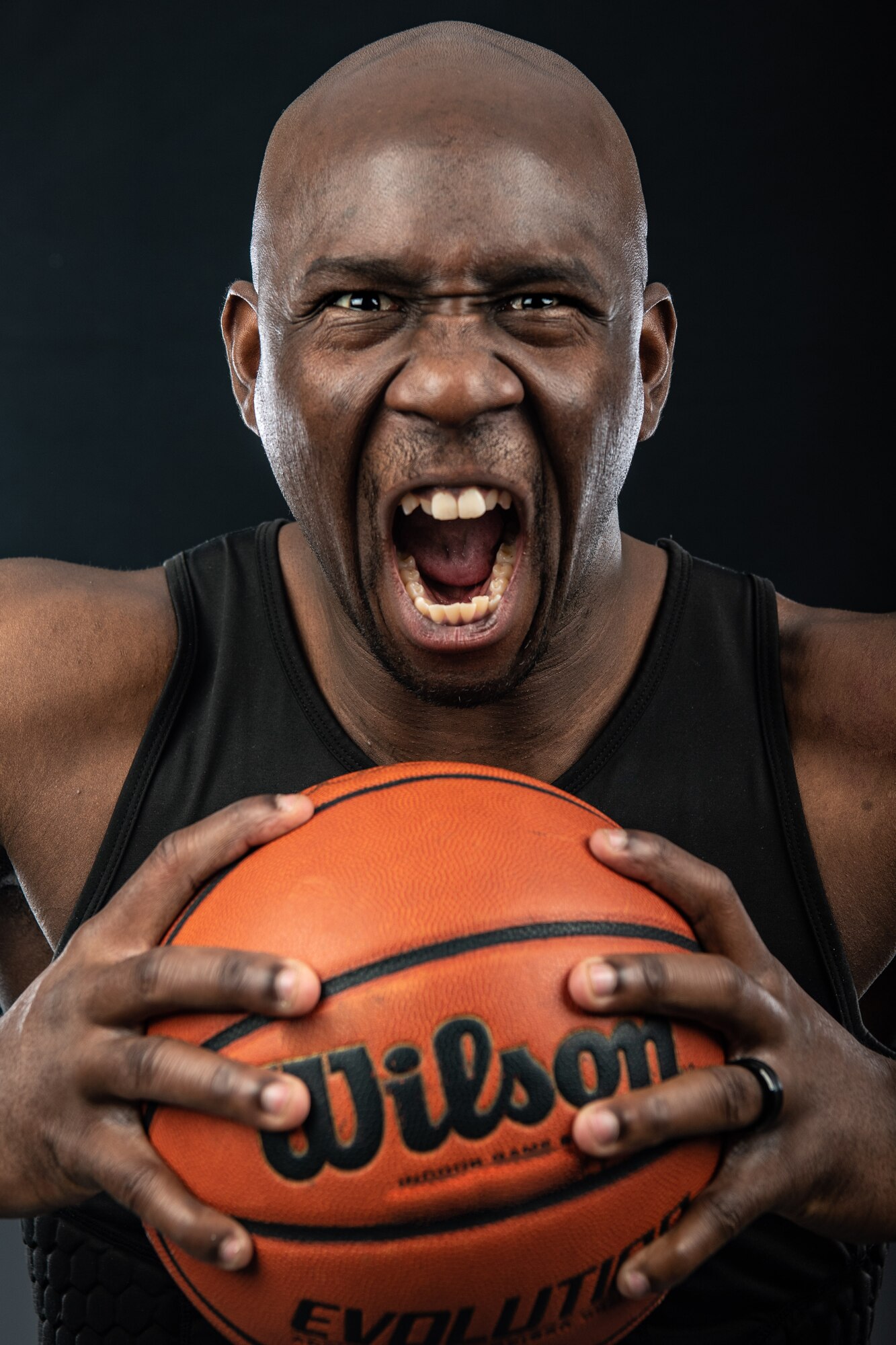 U.S. Air Force Airman 1st Class Ricky Jackson, 377th Air Base Wing Legal Office, poses with a basketball for a portrait at Kirtland Air Force Base, N.M. Jackson plays small forward for his intramural team. (U.S. Air Force photo by Staff Sgt. J.D. Strong II)
