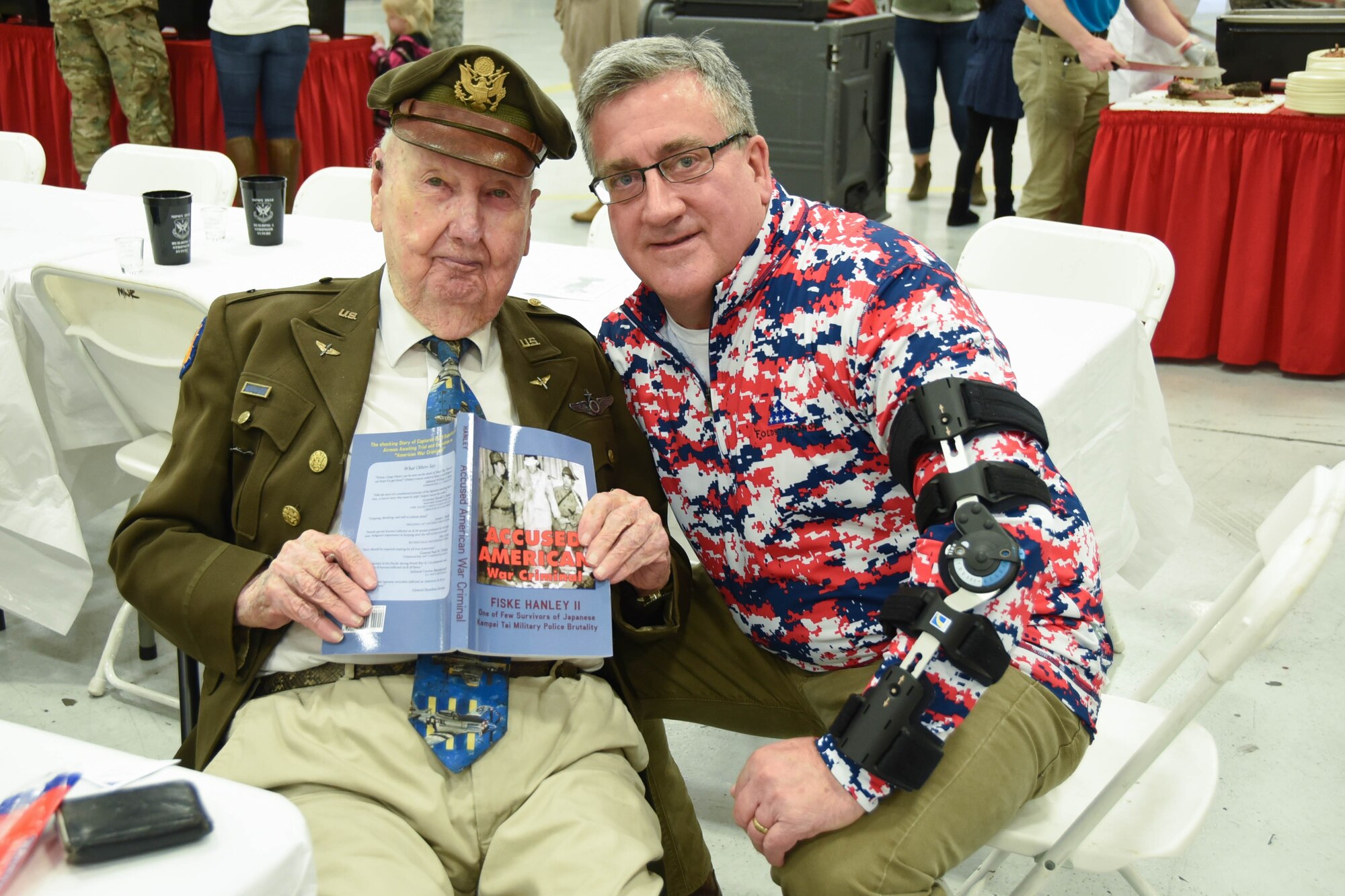 Prisoner of war survivors Mr. Fiske Hanley II, World War II veteran, and Marine Corps Staff Sgt. (ret.) Rodney “Rocky” Sickmann, share similar stories at the Maintenance Professional of the Year (MPOY) ceremony March 2, 2019 at Naval Air Station Fort Worth Joint Reserve Base, Texas. Sickmann was one of 52 Americans held hostage in Iran for 444 days.
(U.S. Air Force photo by Airman 1st Class Brittany Morelock)