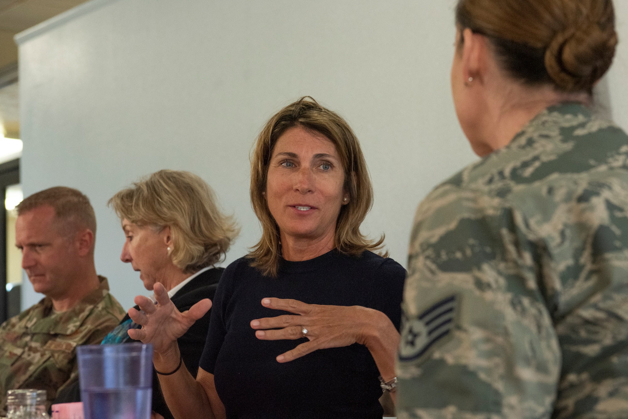 Sarah Troff, converses with Airmen about their experience during and after Hurricane Michael at Tyndall Air Force Base, Fla., Feb. 25, 2019. Sarah, her mother Mary Tyndall Troff and sisters were invited to visit TAFB after Mary sent a letter about her concerns for the base and the well-being of Airmen after Hurricane Michael. (U.S. Air Force photo by Staff Sgt. Alexandre Montes)
