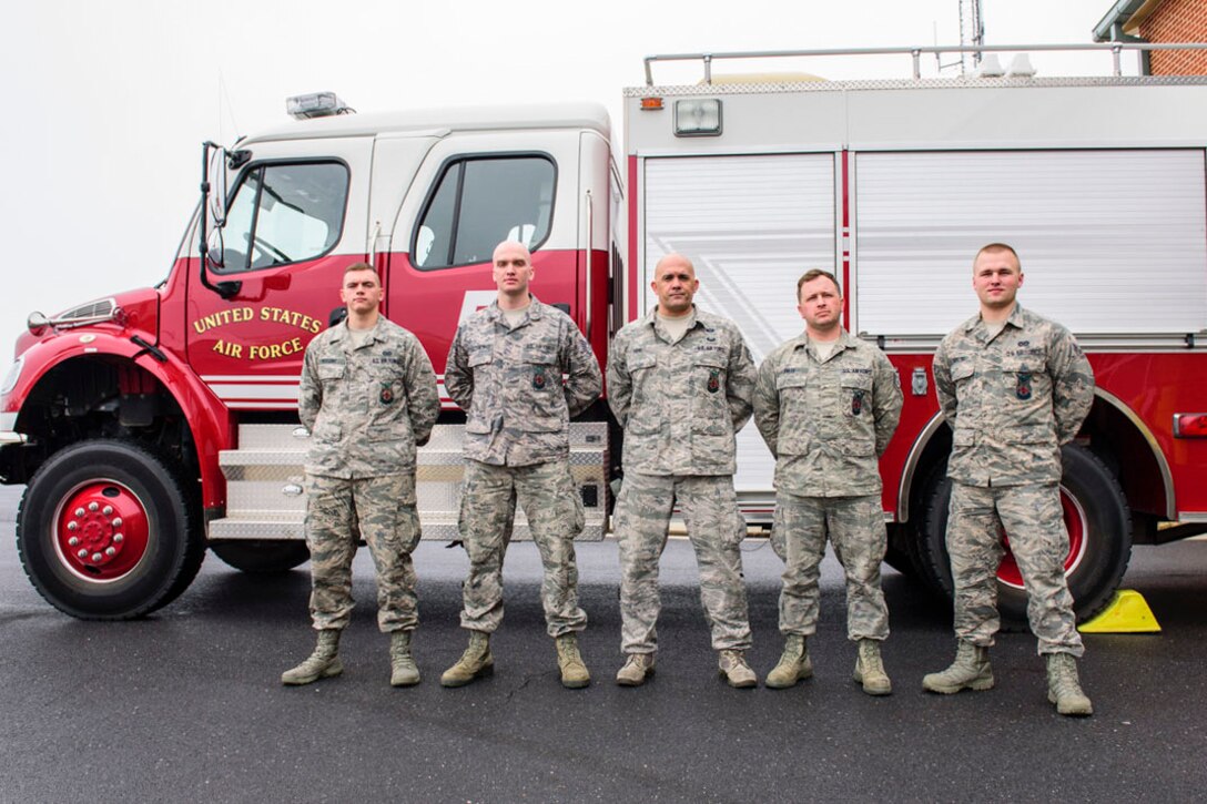 167th Airlift Wing firefighters, Airman Garrison Huggins, Staff Sgt. Ryan Trochimowicz, Staff Sgt. Michael Frye, Staff Sgt. Jason Smith and Airman 1st Class Levi Taylor responded to an early morning car accident, pulling the driver from his burning vehicle, March 2, 2019. (U.S. Air National Guard photo by Tech. Sgt. Michael Dickson)