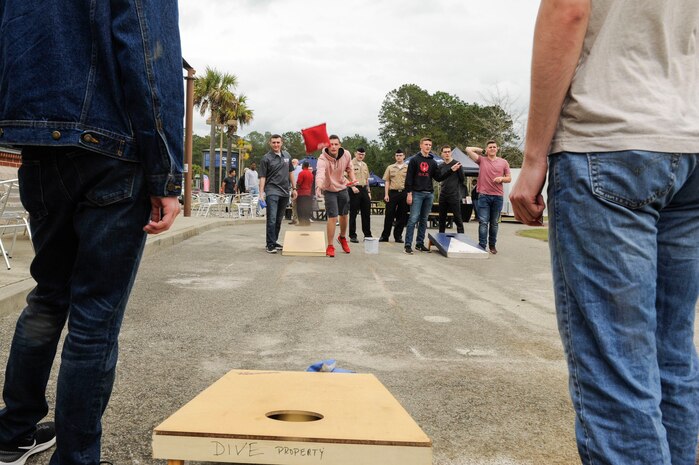 Students from the Navy Nuclear Power Training Command play a game of Cornhole during The Dive grand reopening ribbon cutting ceremony March 1, 2019, on the Naval Weapons Station.