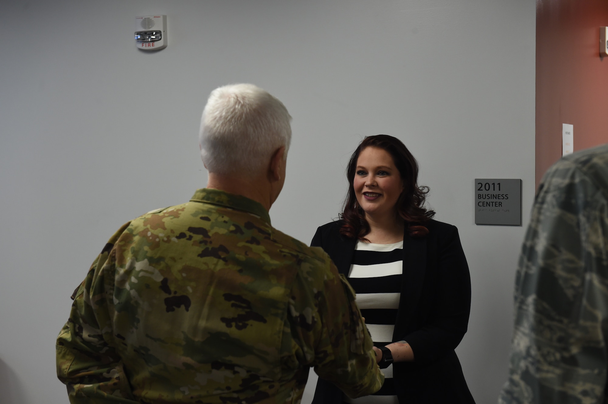 Britny Marin is coined by Lt. Gen. Scott Rice, Director of the Air National Guard, February 13, 2019. Britny won 2018 Joan Orr Air Force Spouse of the Year Award at the Air National Guard level. (U.S. Air National Guard photo by Staff Sgt. Michael J. Kelly)
