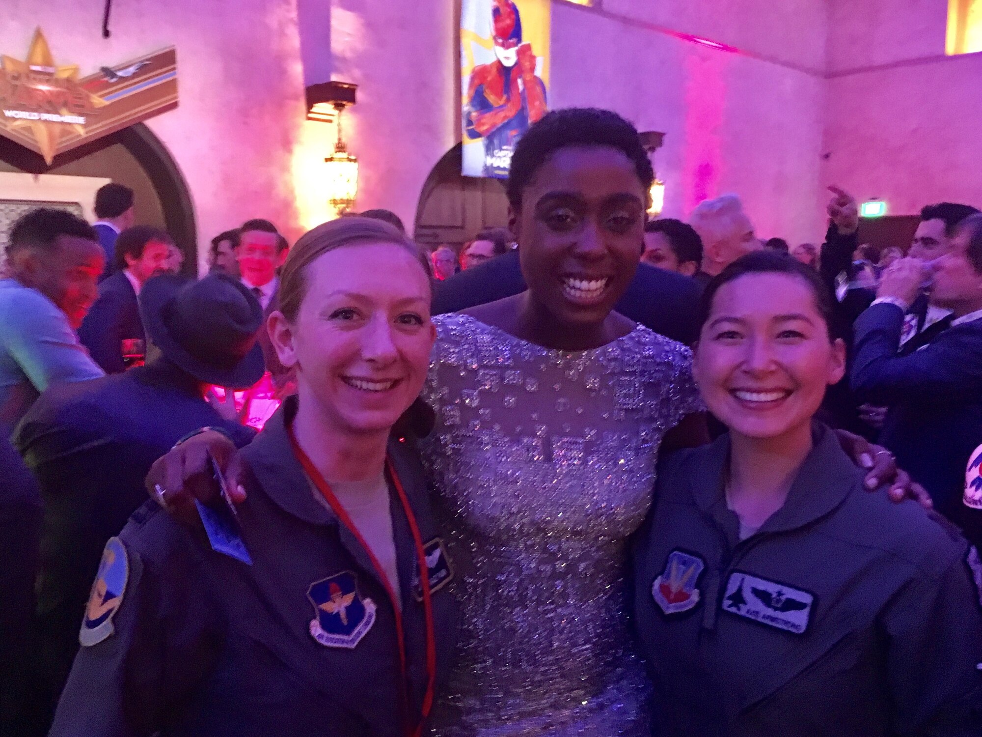 Capt. Danielle Park (left), 311th Fighter Squadron instructor pilot, stands next to Lashana Lynch (middle), who plays Maria Rambeau in Captain Marval, while at the premiere of the film in Los Angeles, Calif, March 4, 2019. Park was invited to attend the premiere of Captain Marval after giving the actress, Brie Larson, a ride in an F-16 Fighting Falcon while stationed at Nellis Air Force Base, Nev. (Courtesy photo)