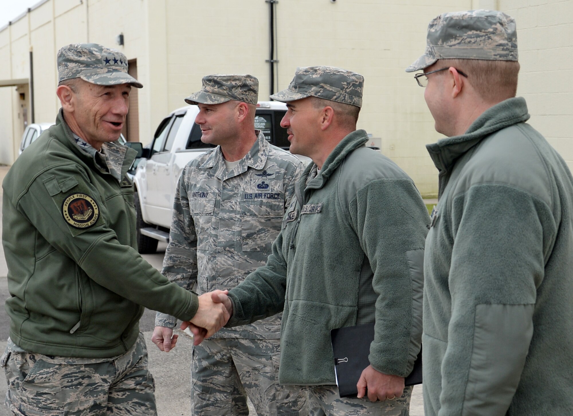 U.S. Air Force Gen. Mike Holmes, commander of Air Combat Command, is greeted by 67th Cyberspace Wing leaders during his visit to Joint Base San Antonio-Lackland, Texas, March 4, 2019. Holmes toured several Air Forces Cyber units to meet Airmen and gain knowledge about the cyber mission. (U.S. Air Force Photo by Tech. Sgt. R.J. Biermann)