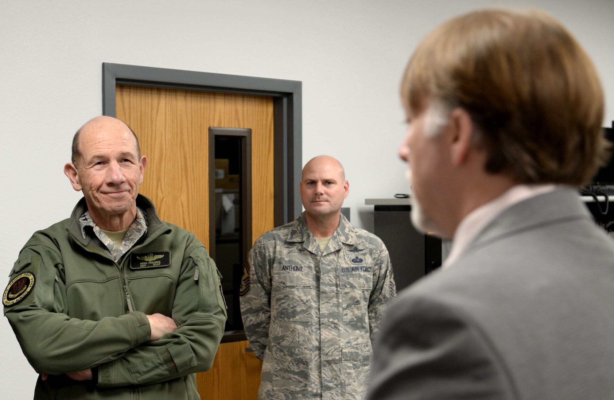 U.S. Air Force Gen. Mike Holmes, commander of Air Combat Command, receives a 346th Test Squadron Unified Capabilities Assessment building tour from Ryan Bradshaw, 346th TS UCAP program lead, during his visit to Joint Base San Antonio-Lackland, Texas, March 4, 2019. The UCAP team provides Department of Defense Information Network Approved Products List testing before the equipment can be connected to the DODIN. (U.S. Air Force Photo by Tech. Sgt. R.J. Biermann)